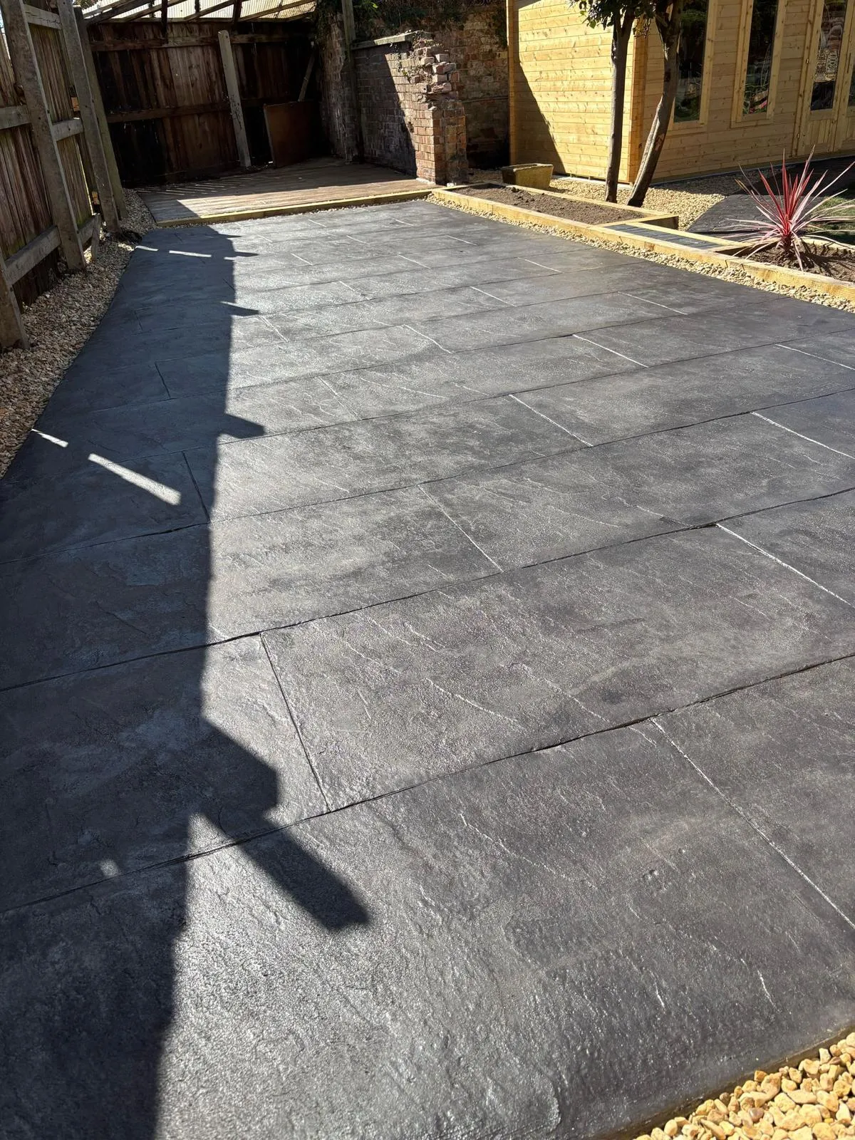 Pattern-imprinted concrete driveway in Ely by Urban Planet Construction