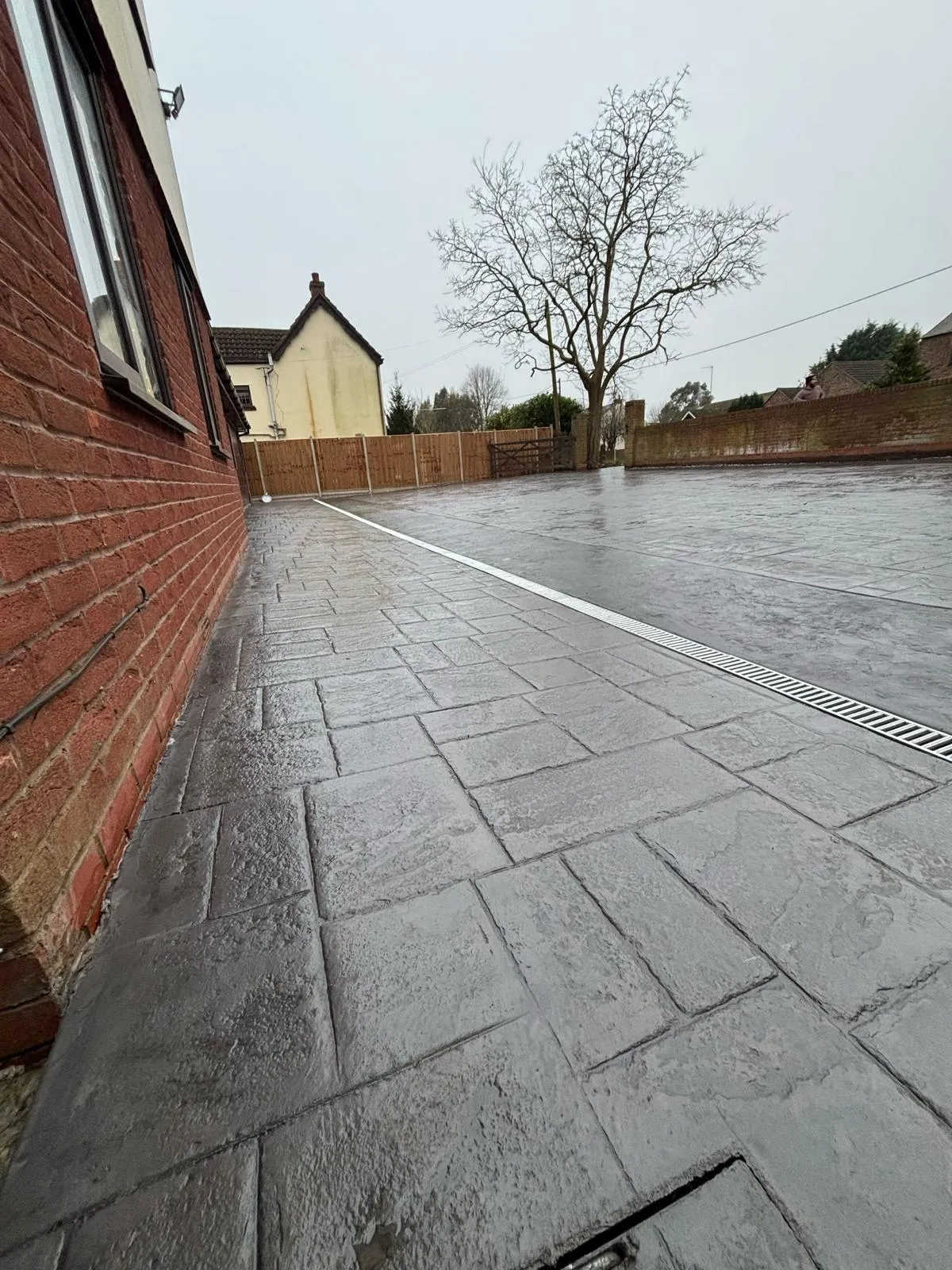 Pattern-imprinted concrete driveway in Whittlesey by Urban Planet Construction