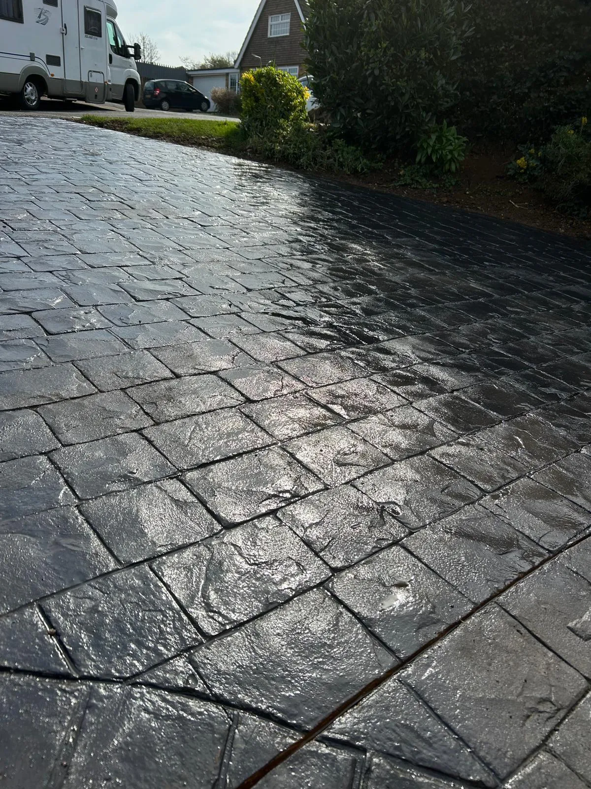 Pattern-imprinted concrete driveway in Ramsey by Urban Planet Construction