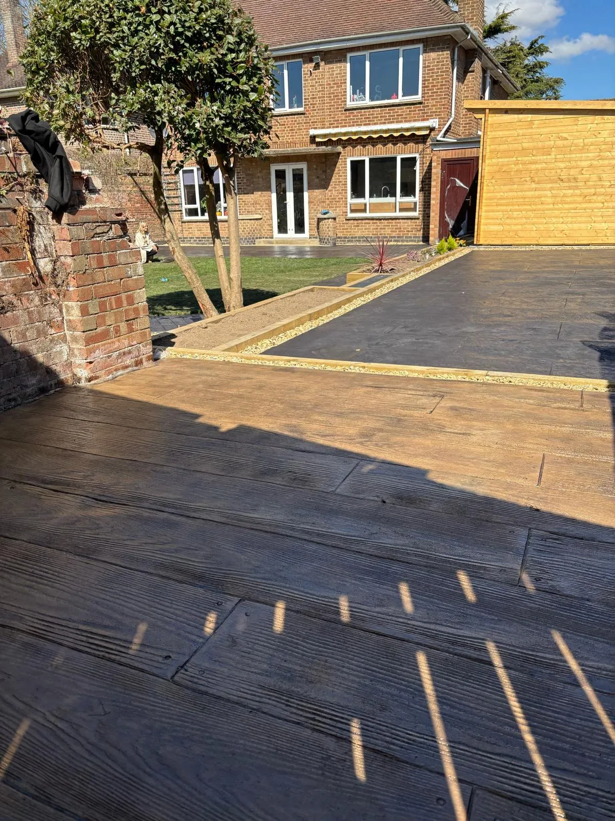 Pattern-imprinted concrete driveway in Swaffham by Urban Planet Construction