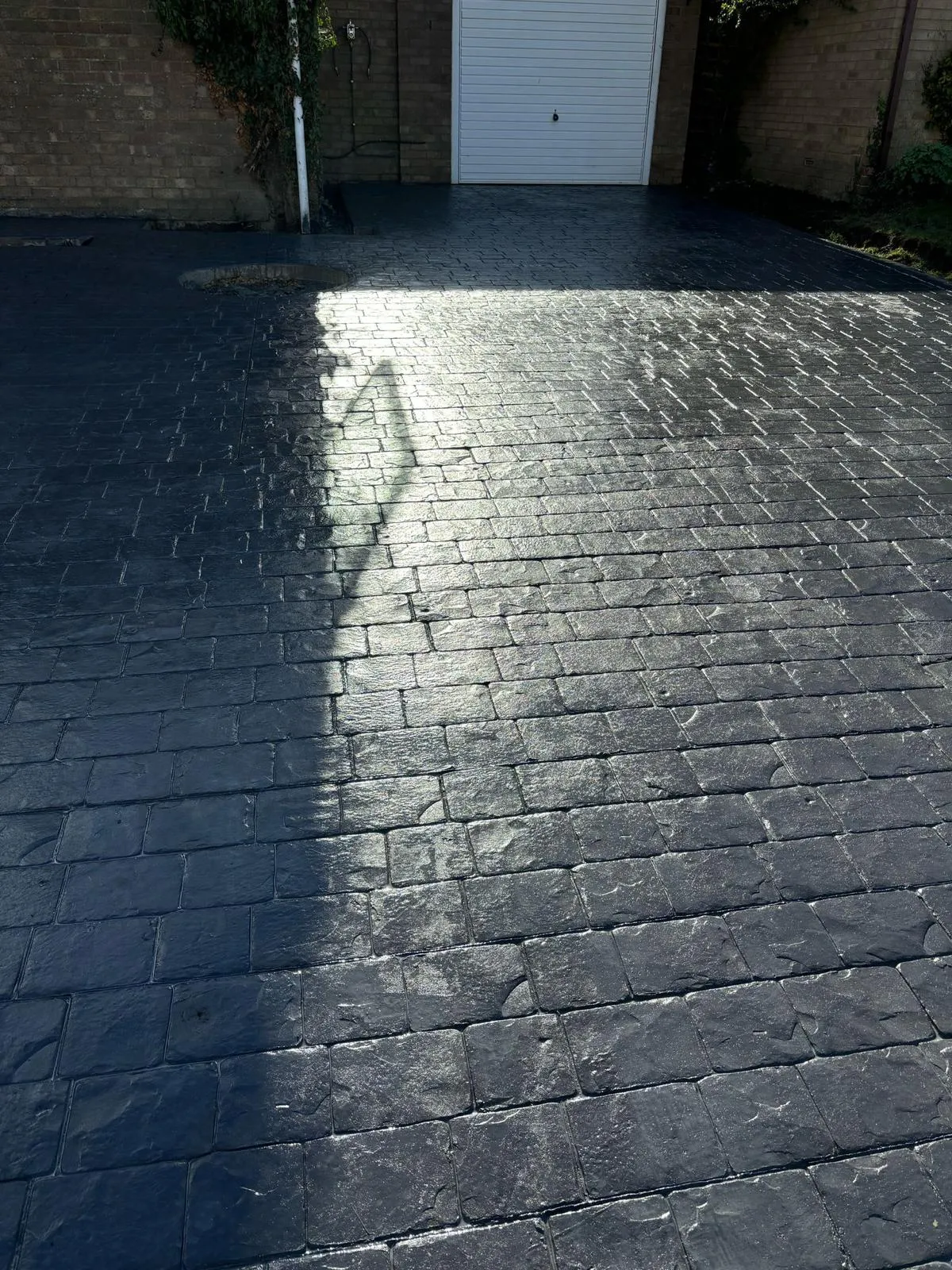Pattern-imprinted concrete driveway in King