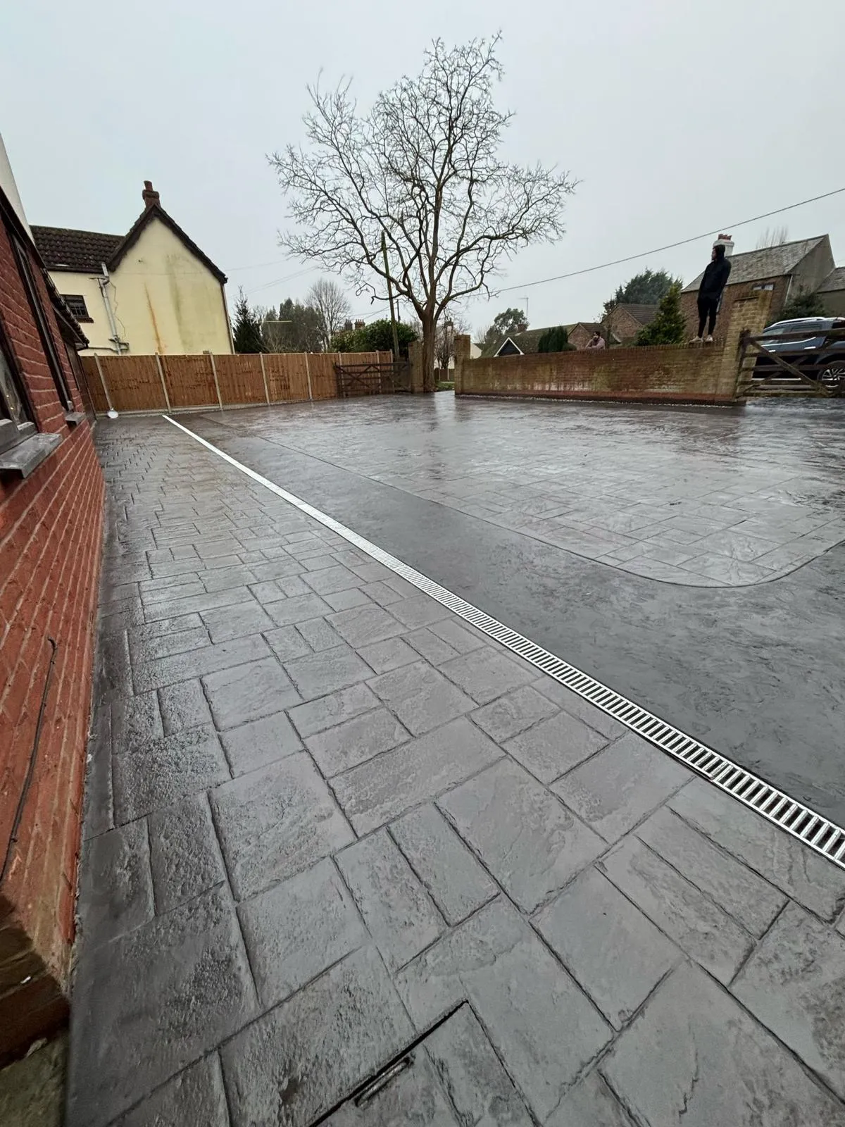 Pattern-imprinted concrete driveway in Peterborough by Urban Planet Construction