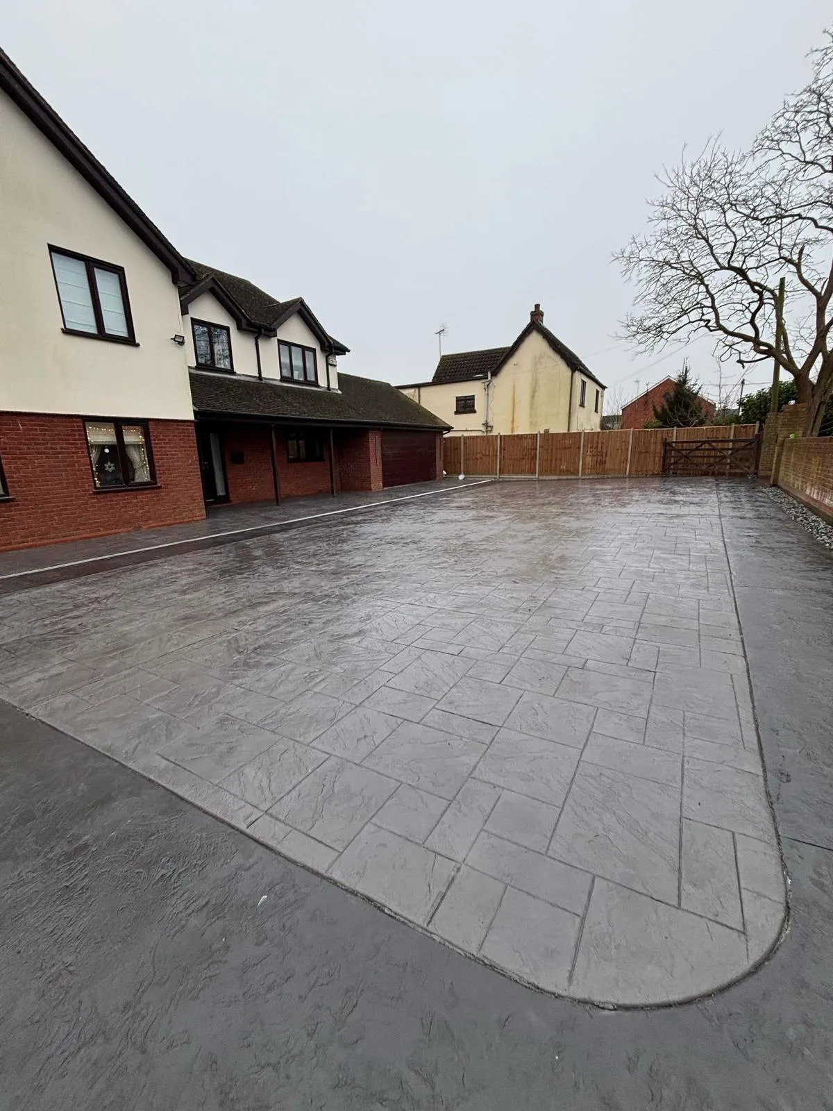 Pattern-imprinted concrete driveway in Ely by Urban Planet Construction