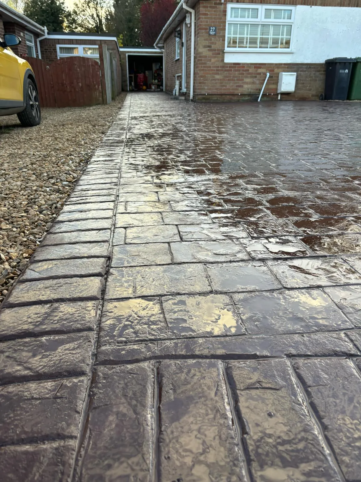 Pattern-imprinted concrete driveway in Spalding by Urban Planet Construction