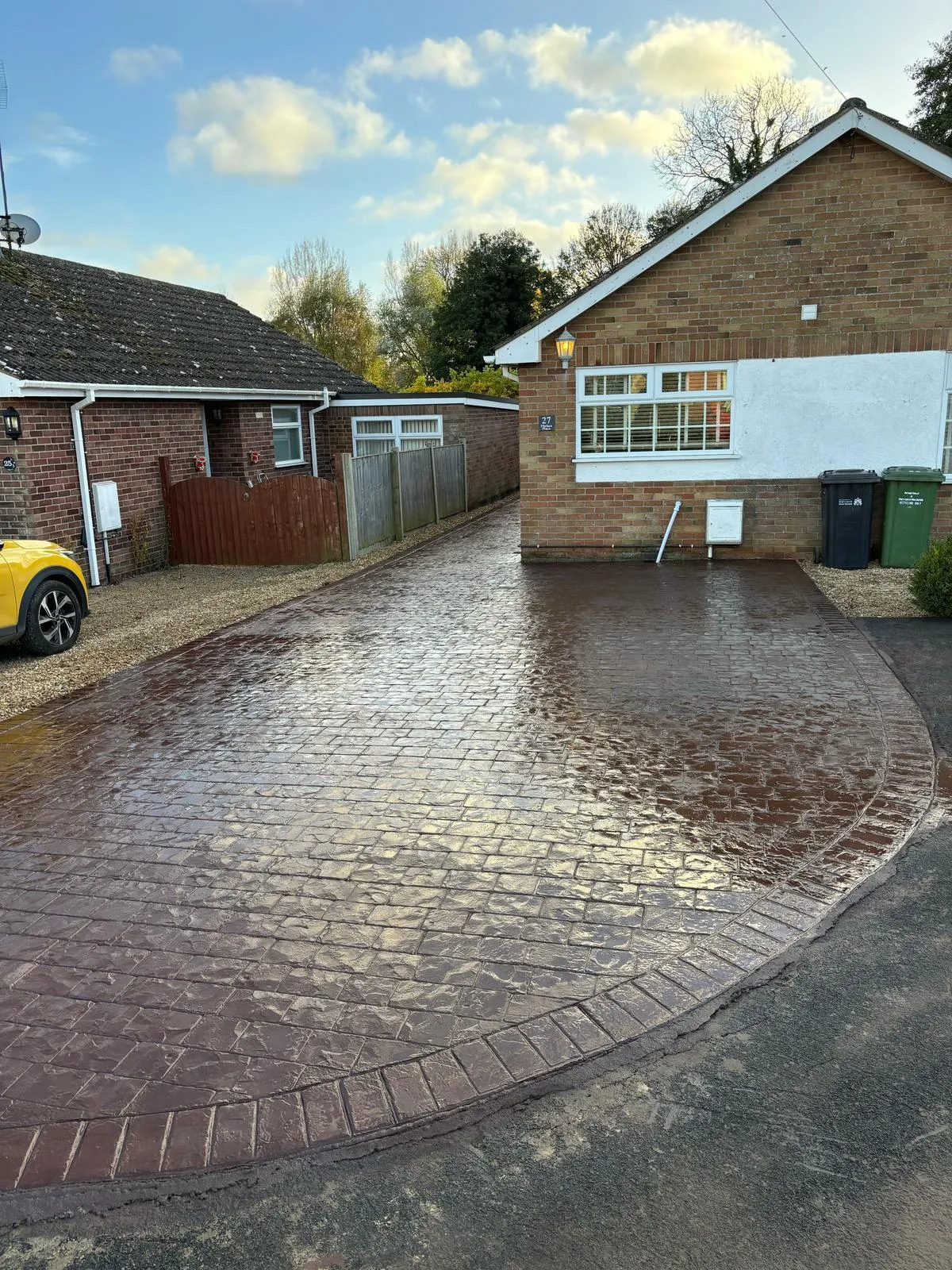 Pattern-imprinted concrete driveway in Downham Market by Urban Planet Construction