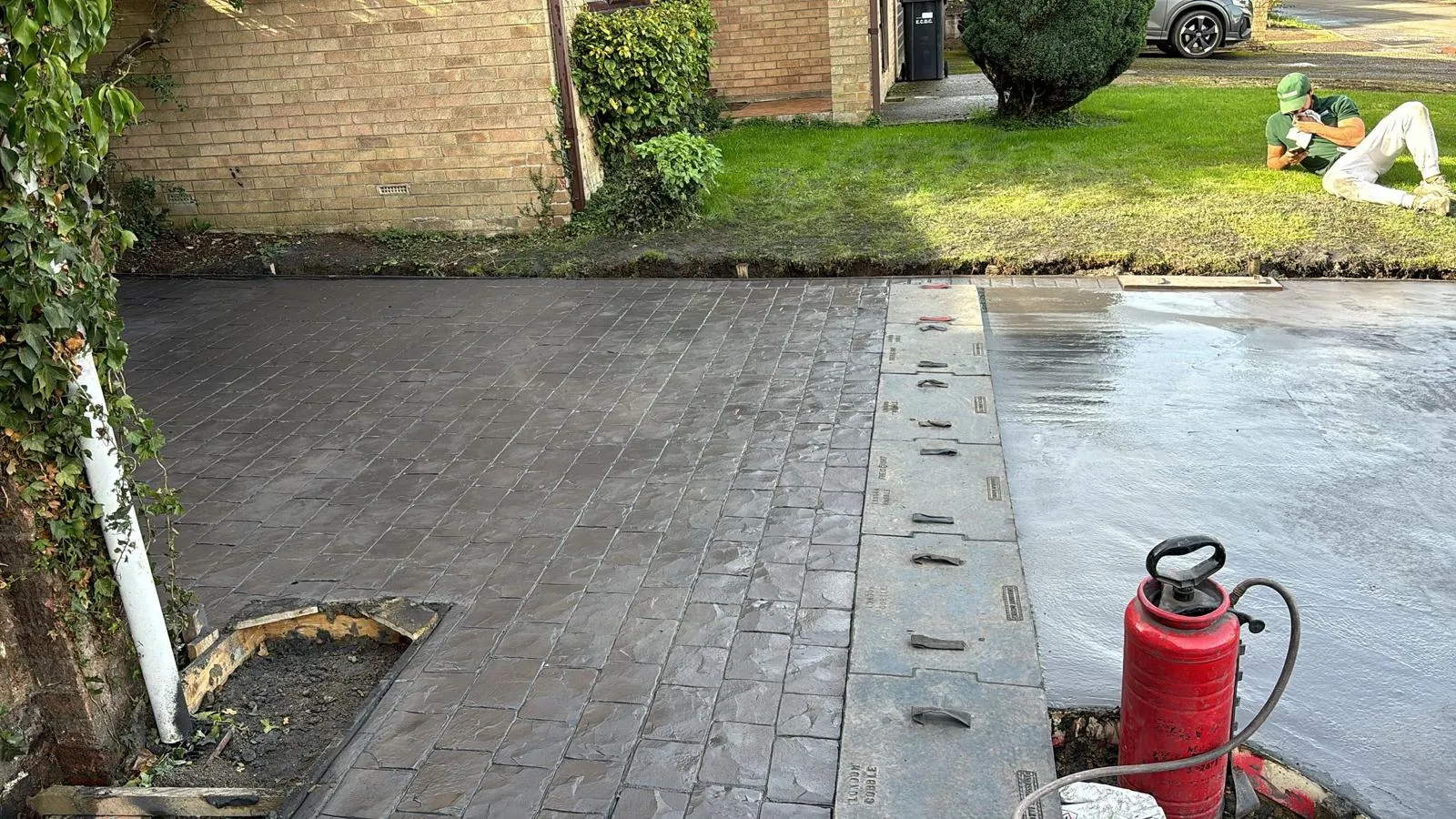 Pattern-imprinted concrete driveway in Whittlesey by Urban Planet Construction