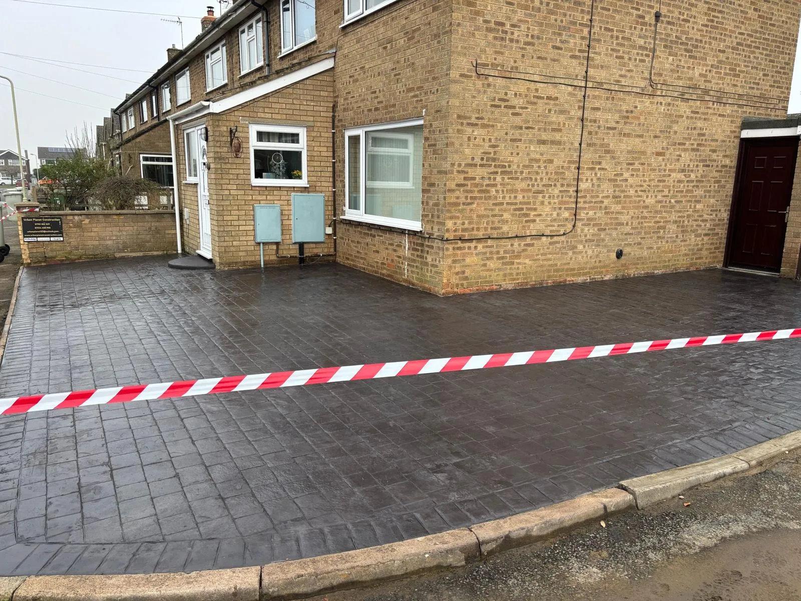 Pattern-imprinted concrete driveway in Swaffham by Urban Planet Construction