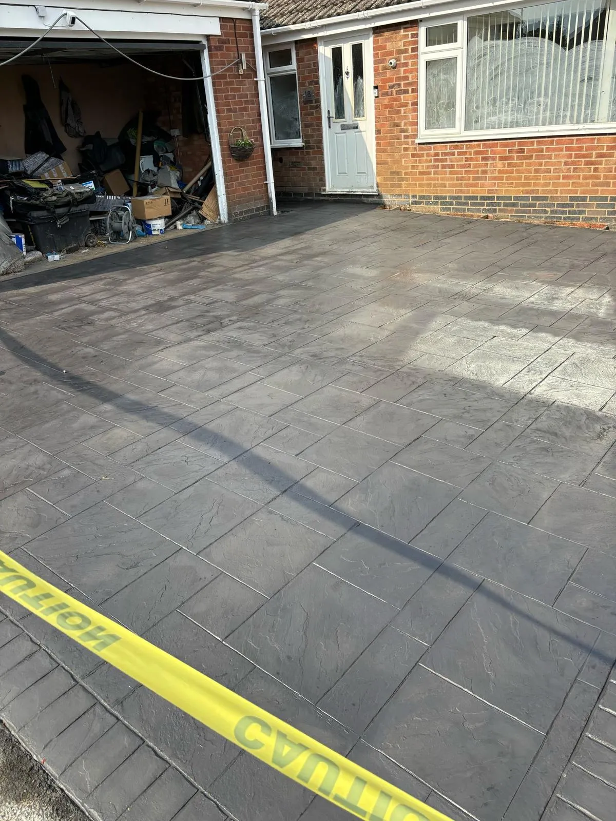 Pattern-imprinted concrete driveway in Long Sutton by Urban Planet Construction