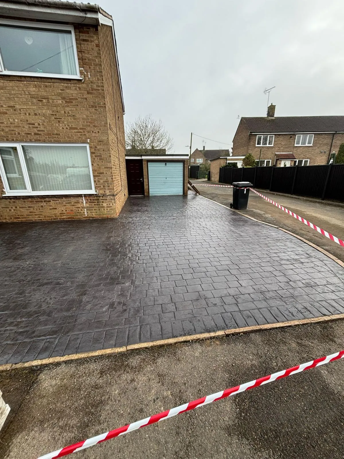Pattern-imprinted concrete driveway in St Ives by Urban Planet Construction
