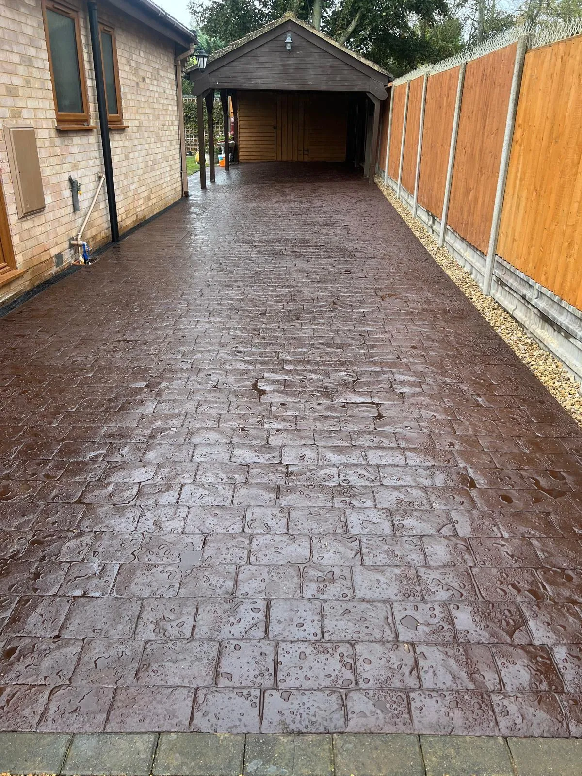 Pattern-imprinted concrete driveway in Boston by Urban Planet Construction