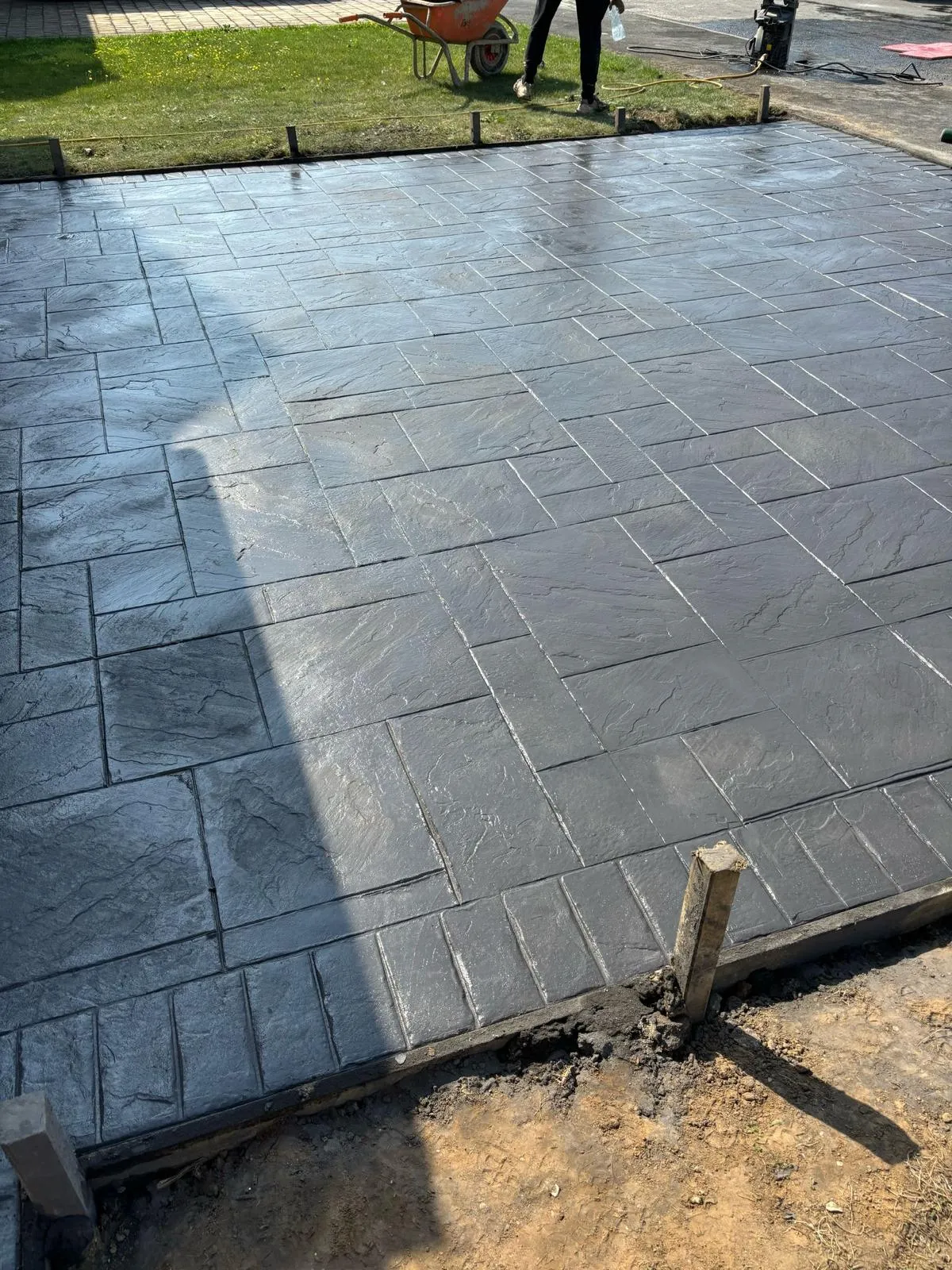 Pattern-imprinted concrete driveway in Upwell & Outwell by Urban Planet Construction