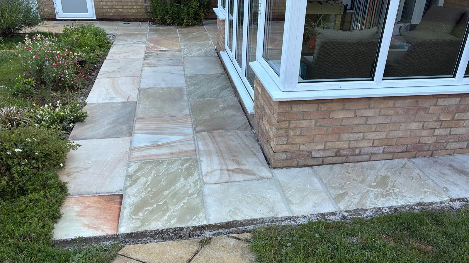 Indian sandstone patio by Urban Planet Construction