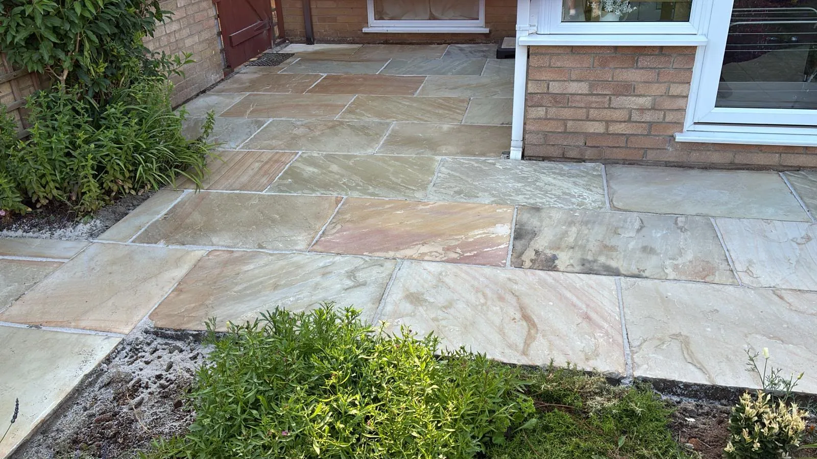 Indian sandstone patio by Urban Planet Construction